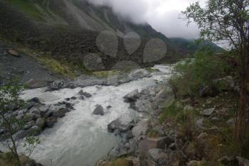 Mountain landscape. Highlands, the mountain peaks, gorges and valleys. The stones on the slopes.