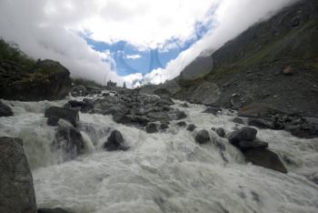 Mountain landscape. Highlands, the mountain peaks, gorges and valleys. The stones on the slopes.