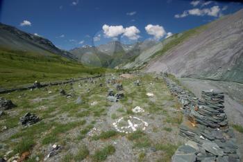 Mountain landscape. Highlands, the mountain peaks, gorges and valleys. The stones on the slopes.