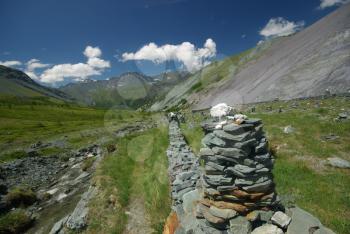 Mountain landscape. Highlands, the mountain peaks, gorges and valleys. The stones on the slopes.