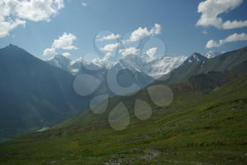 Mountain landscape. Highlands, the mountain peaks, gorges and valleys. The stones on the slopes.