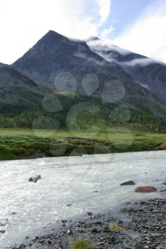 Mountain landscape. Highlands, the mountain peaks, gorges and valleys. The stones on the slopes.