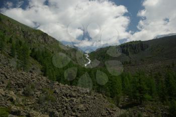 Mountain landscape. Highlands, the mountain peaks, gorges and valleys. The stones on the slopes.