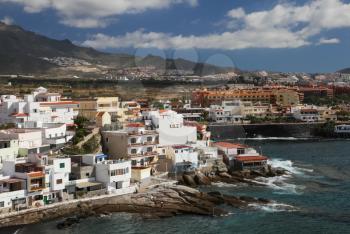 Costa Adeje, Tenerife, Spain - July 28, 2013: The islands of Tenerife is a resort for tourists. Coast of the sea and hotels on the beach.