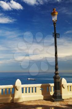 Street lamp in front of the sea, Algiers, Algeria
