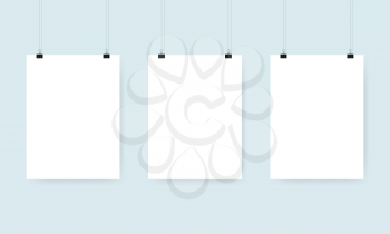 Three blank white poster with binder clips. Mockup design. Vector illustration.