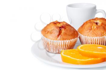 Two muffins and orange slices on a white background