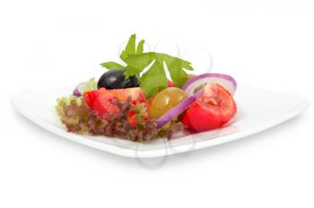 fresh vegetable salad in white dish on white background