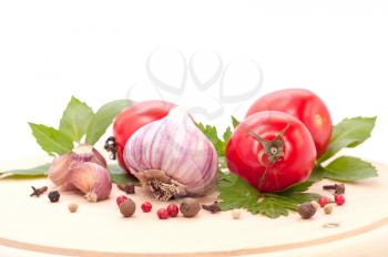 red tomato and garlic on white background