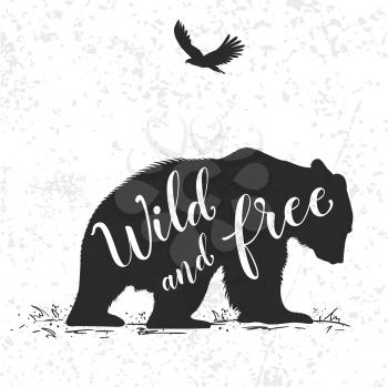 Silhouette of a wild bear and calligraphy. Wild life in nature.