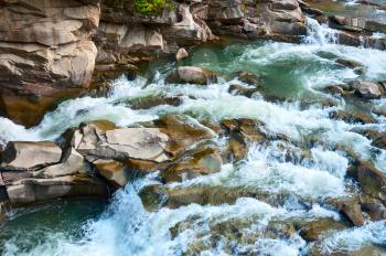 Rapid mountain river in the Carpathian mountains. Nature of Ukraine.