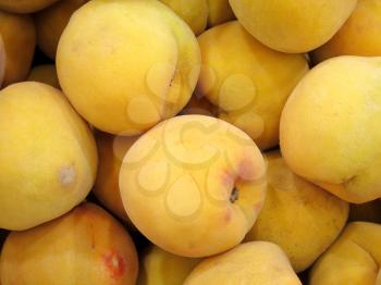 Ripe fresh peaches as background closeup