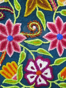 Peruvian hand made flower woolen fabric background