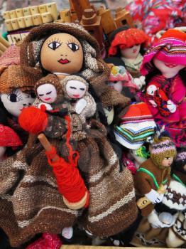 Peruvian hand made doll woolen fabric background