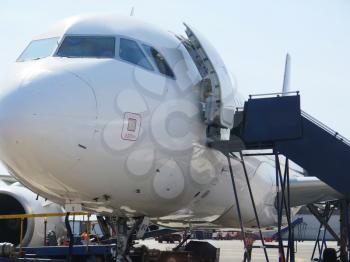 Aerobridge in plane parked in the airport waiting for passengers