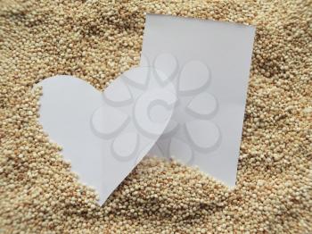 Heart shape on raw cous cous semolina background