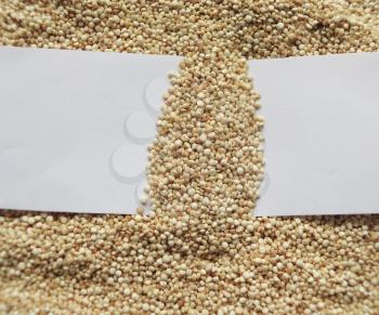 White paper on raw cous cous semolina background