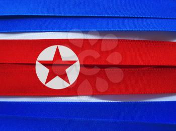 North Korea flag or banner made with red, blue and white ribbons