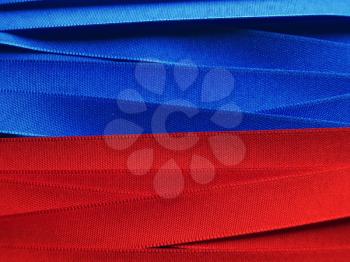 Shiny blue and red satin ribbon background