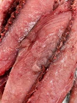 Tuna raw meat in a butcher shop, top view