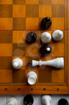 old chess on a chess classic wooden board on a dark background