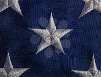 white star one of many on the usa national flag close-up on a blue background