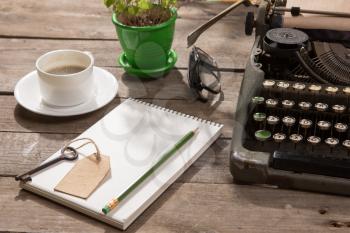 Vintage typewriter on the old wooden desk