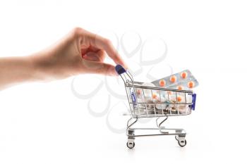 Isolated shopping cart full with pills and capsules