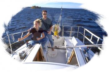 Royalty Free Photo of a Couple on a Sail Boat