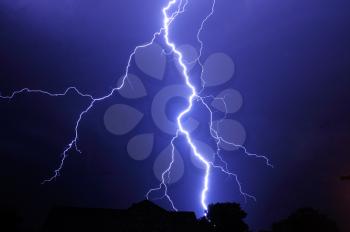 Night shot with big thunderstorm at the starry sky.