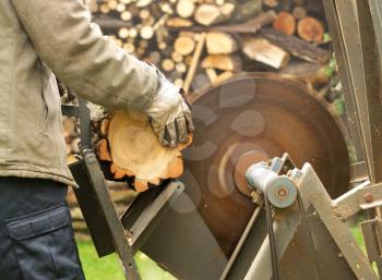 Working man with the circular saw.