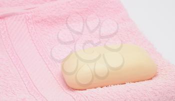 Small soap on the pink towel.