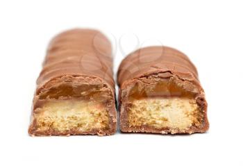 Two chocolate bars with caramel and cookie on a white background.  Front view on a chocolate bars.