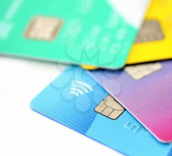 Close up of multicolored credit cards collection on white background.