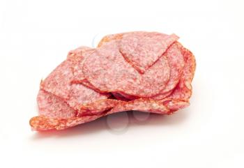 Heap of thinly sliced salami on white background.