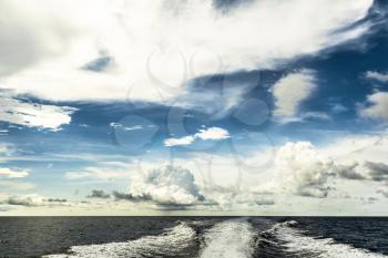 Motor boat water traces in open caribbean sea. Travel destination