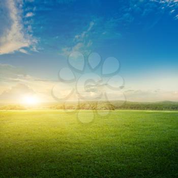 Natural landscape. Meadow and clouds sunrise nature background