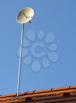ifi wireless internet antenna installed on family house roof.