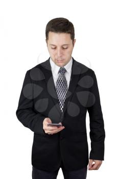 Businessman in Black Suit Holding Smartphone in Hand And Typing Message Against White Background