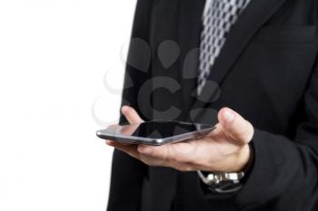 Businessman in Back Suit and Tie Holding Smartphone in Hand Against White Background