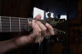 Acoustic Guitar Player Performing. Guitarist Playing In Music Studio