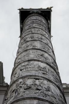 Pillar at Karlskirche Church In Vienna Austria On Dramatic Cloudy Day