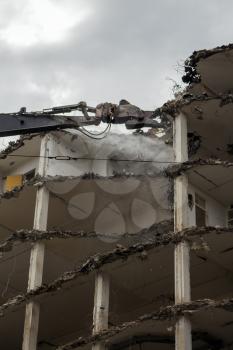 Demolition Pulveriser Demoliting Building in the City