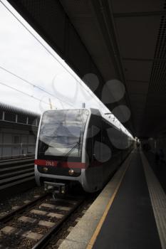 Subway Station Outdoors With Train Approaching Its Stop