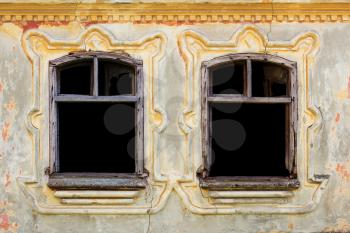 Windows With Vintage Decor On a Ornate, Rustic, Worn, Aged Wall