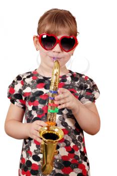 little girl playing music on saxophone