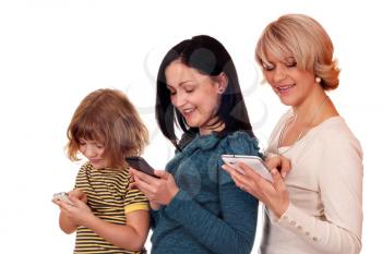 little girl teenage girl and woman playing with smart phone and tablet 
