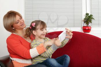 happy mother and daughter fun with tablet pc