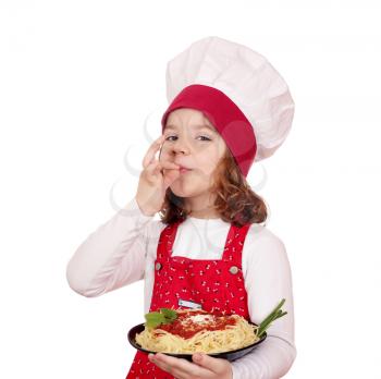 little girl cook holding a plate of spaghetti