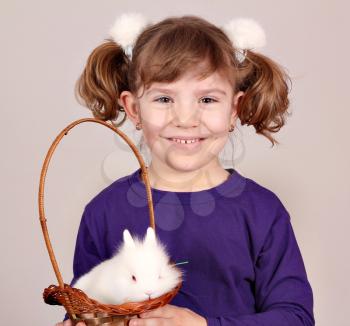 beautiful little girl and white dwarf bunny pet